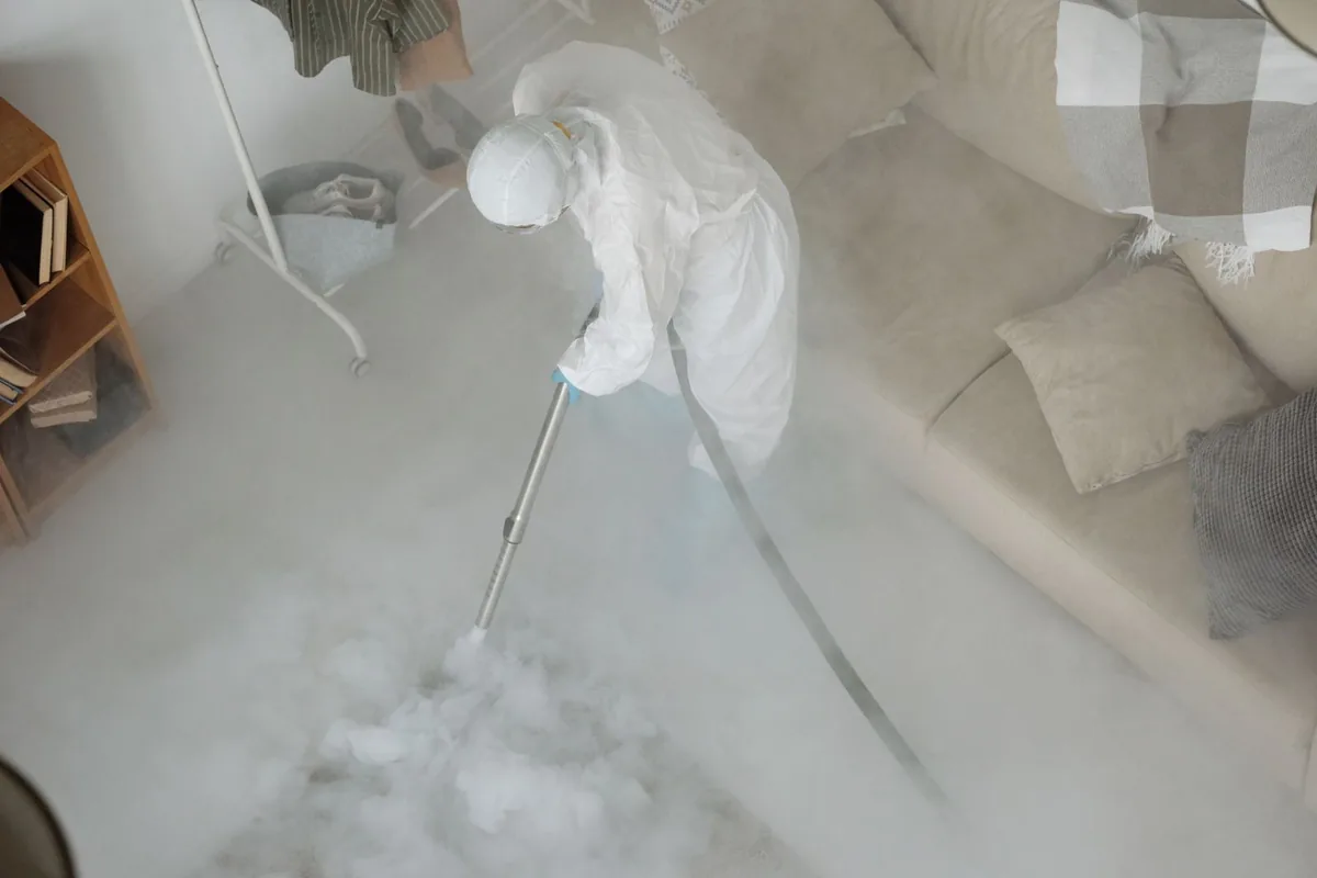 Biohazard cleanup technician in protective equipment, Jolivue, VA